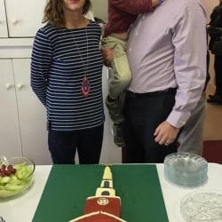 Pastor Brent and his son with a congregant, in front of a cake made to look like the congregational church