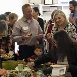 Pastor Brent and others at a potluck meal