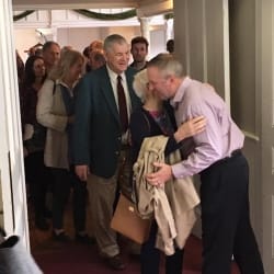 Pastor Brent hugs a congregant