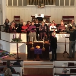 The choir sings during worship