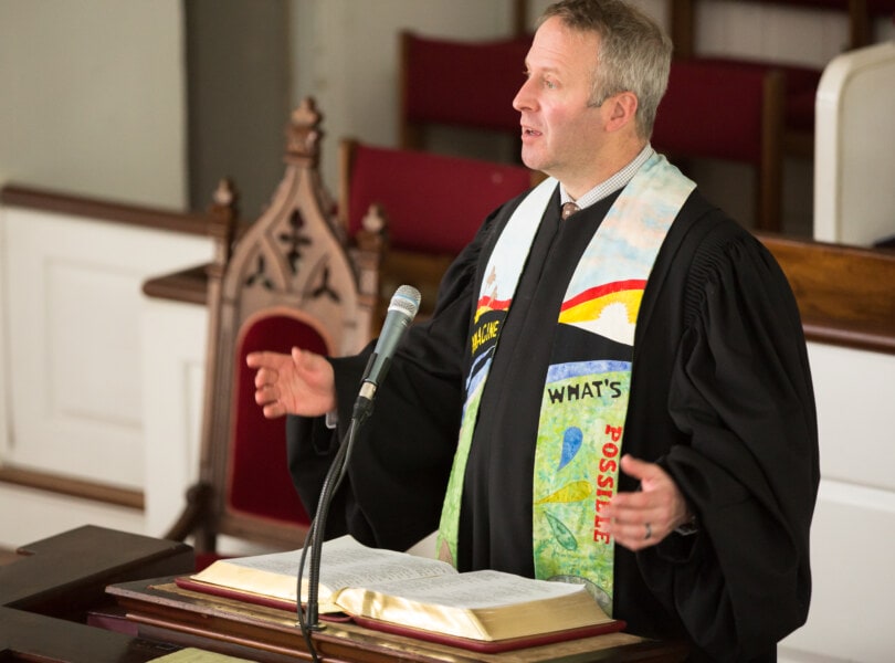 Pastor Brent Damrow preaches from the pulpit