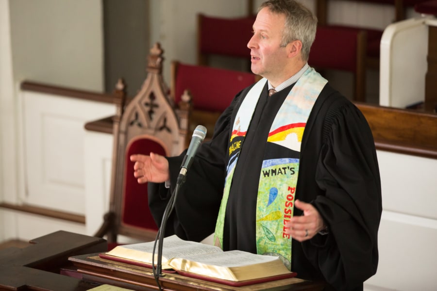 Pastor Brent Damrow preaches from the pulpit